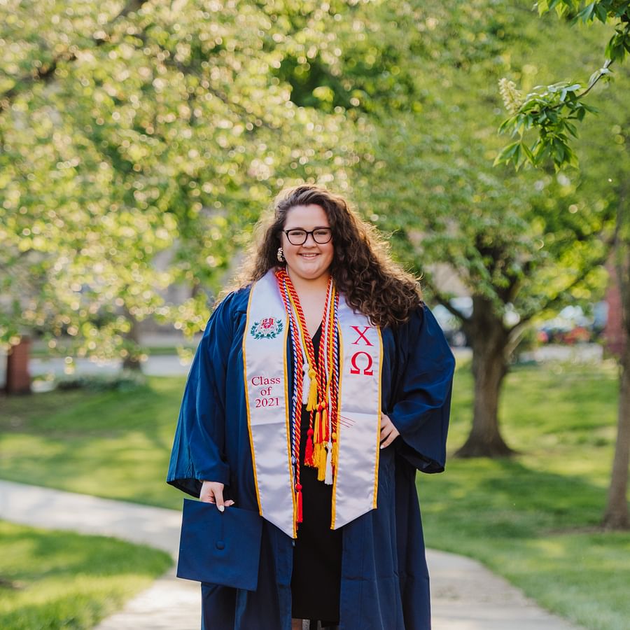 Two graduation caps symbolizing DDS and DMD dental degrees