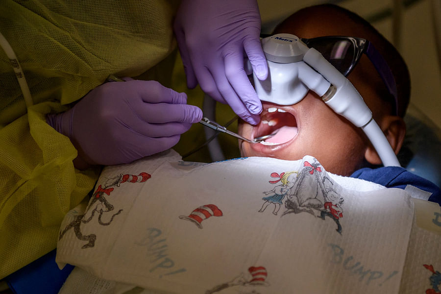 Pediatric dental resident working with a child