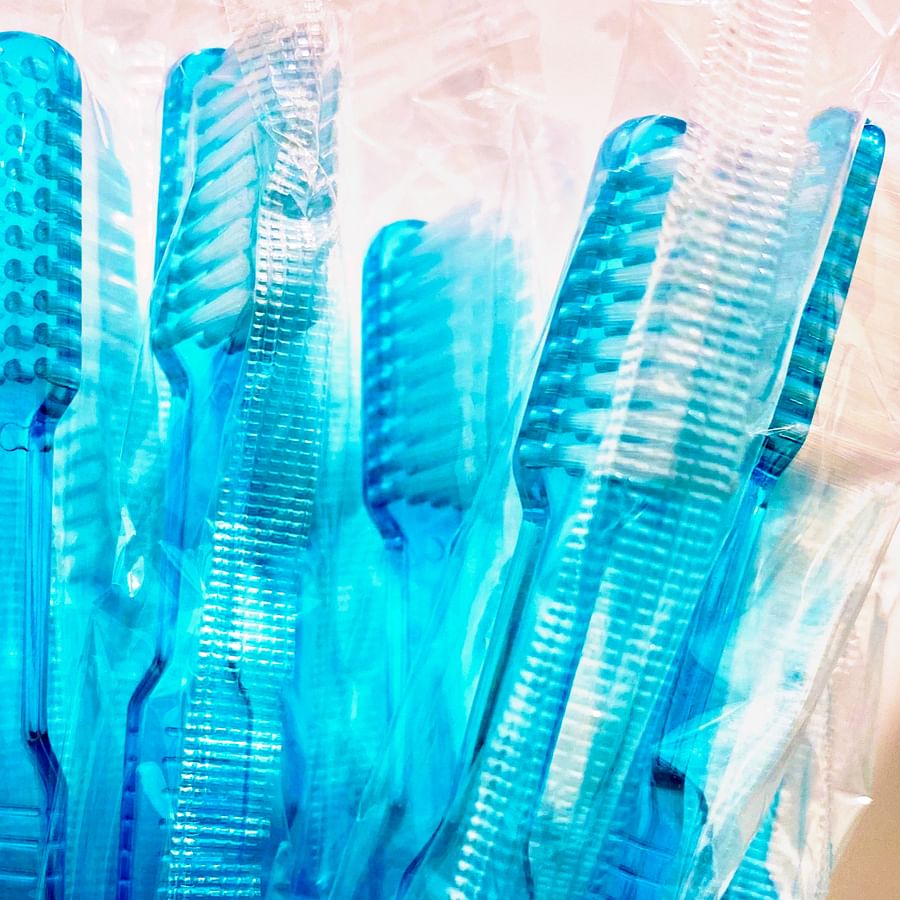 Dentist performing oral check-up on patient