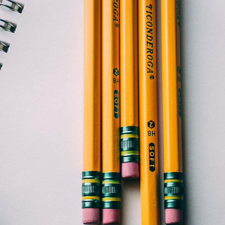 Dental graduate proudly holding her degree